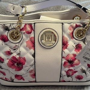 Beautiful floral purse, new with tags.
